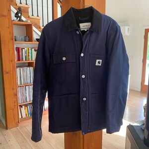 Carthart WIP women’s chore coat lined with warm quilted fabric inside.